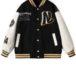 Customizable baseball jacket with embroidered number and leather sleeves.