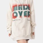 Oversized beige streetwear hoodie modeled for trendy brands, available in bulk custom orders.