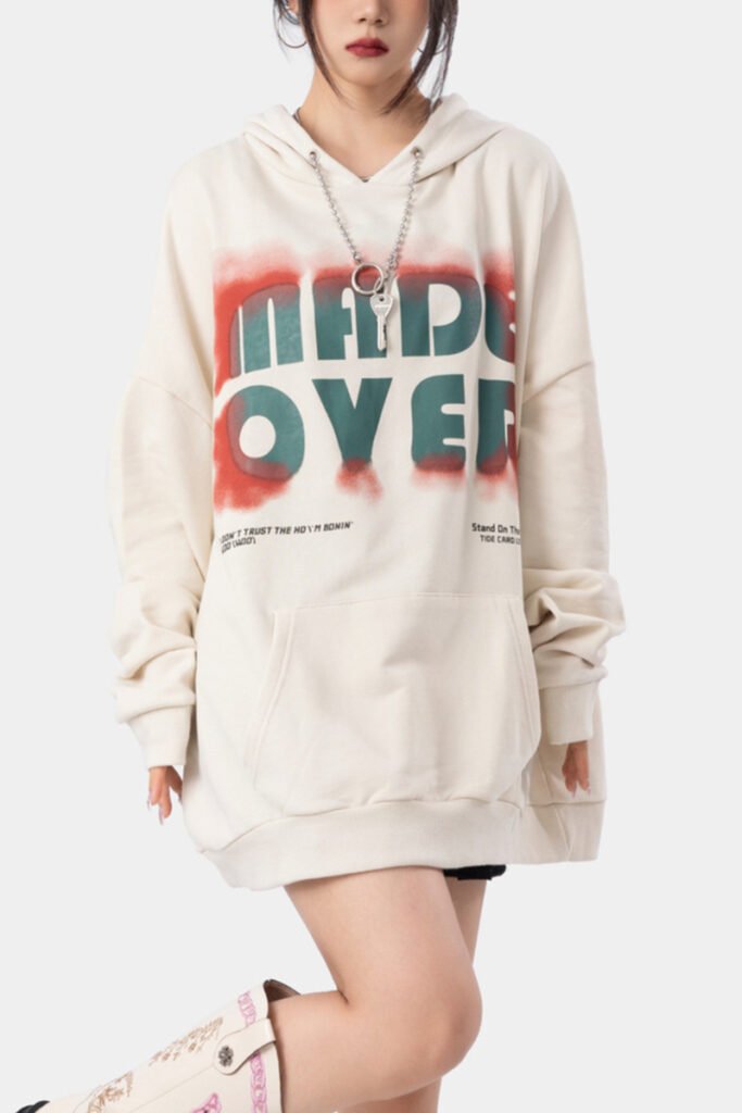Oversized beige streetwear hoodie modeled for trendy brands, available in bulk custom orders.