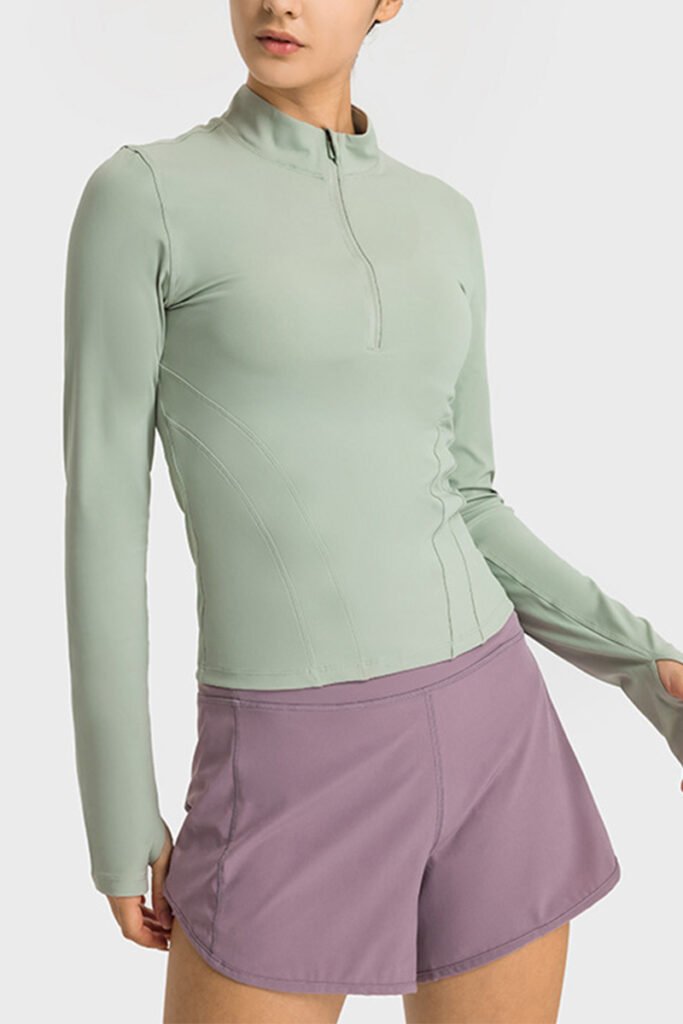 Front view of stylish ladies gym wear zip-up sports top by Yuanyi Apparel