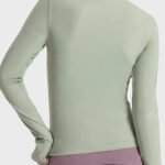 Back view of athletic zip-up womens sweatshirt highlighting streamlined design and breathable fabric