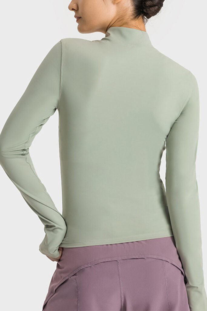Back view of athletic zip-up womens sweatshirt highlighting streamlined design and breathable fabric