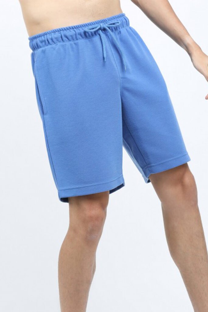 Model wearing Custom Gym Shorts Mens during a workout, YY025.