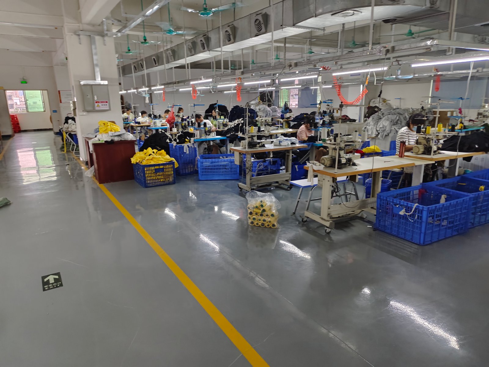 Workers in Clothing OEM Manufacturer produce clothing